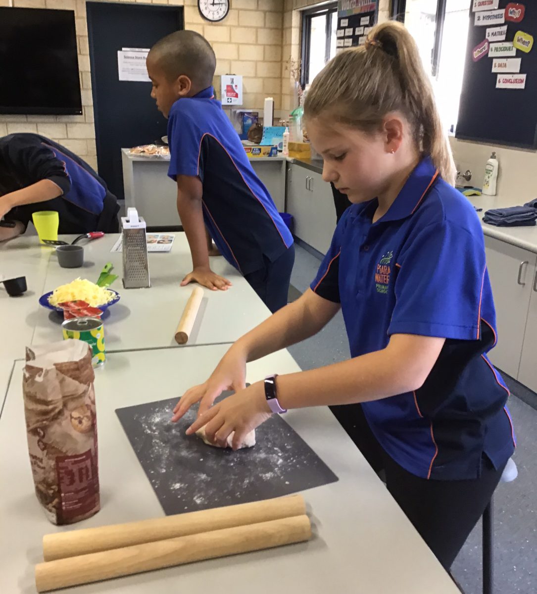 Student kneading dough