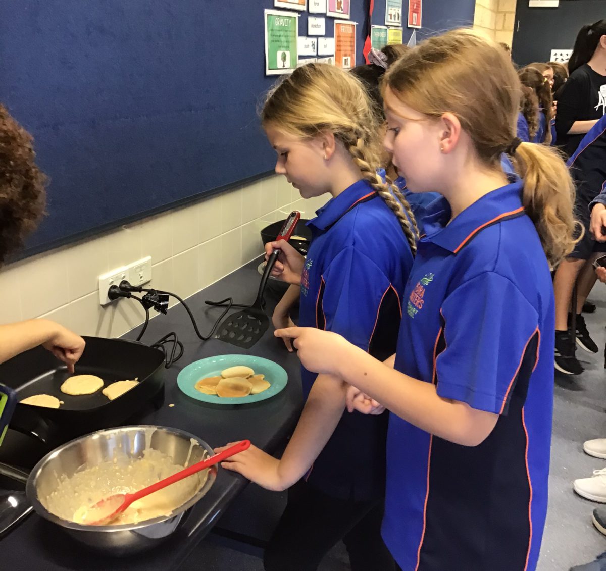 Students cooking FEAST banana pikelets